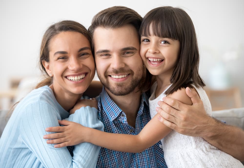 Coastline Dental Emergency Smiling Family